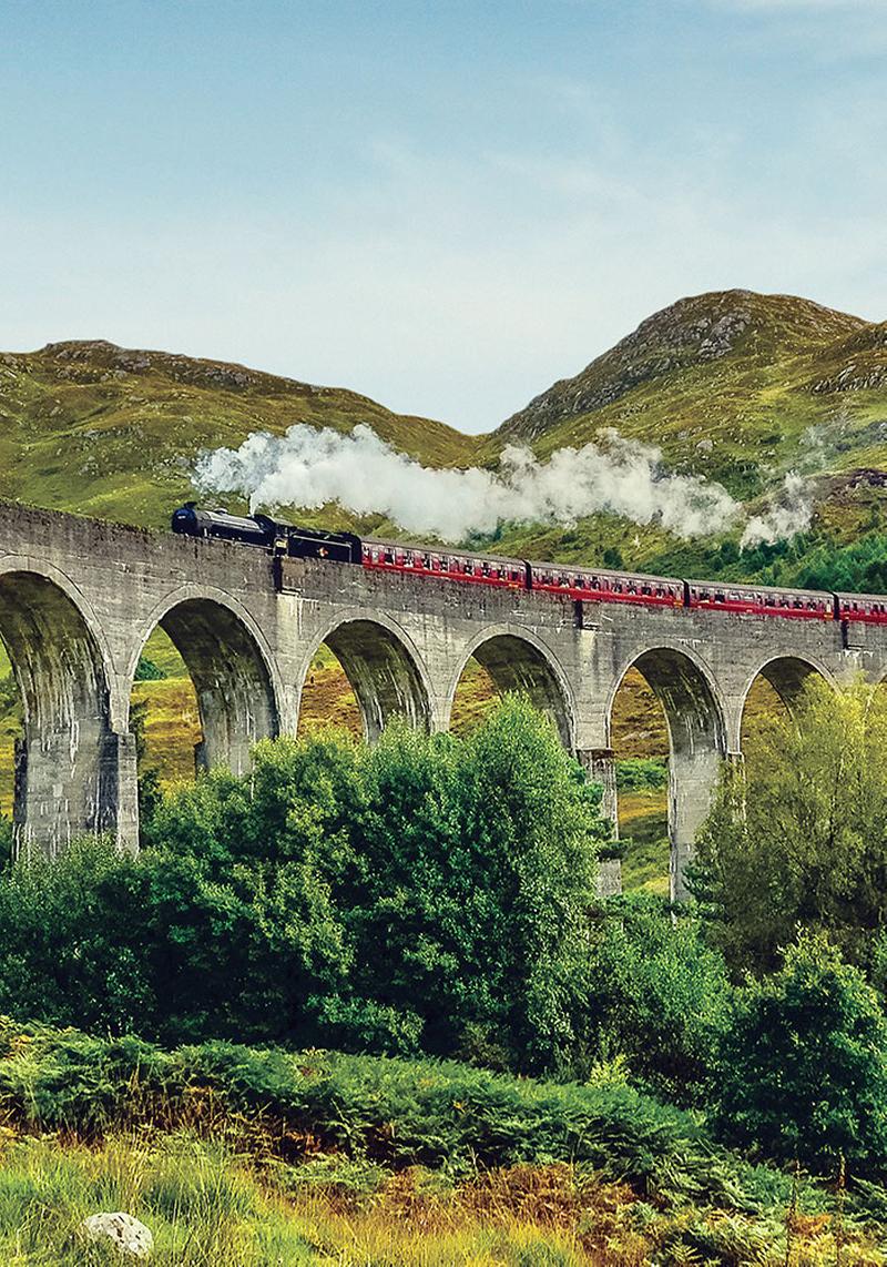Jacobite Steam Train passing over the Glenfinnan Viaduct at Loch Shiel, Highlands 