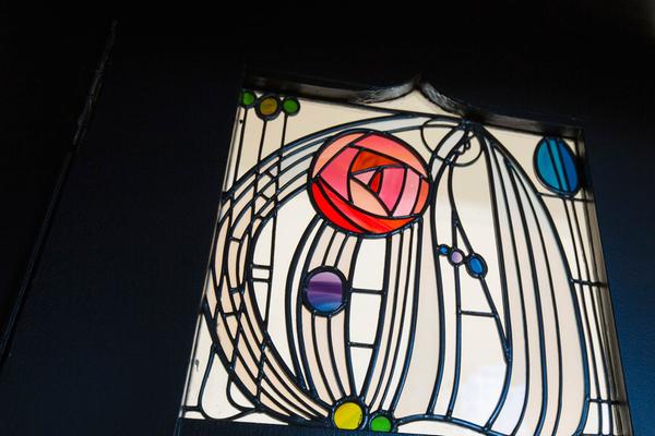 Stained glass rose motif in the Charles Rennie Mackintosh-designed House For an Art Lover, Bellahouston Park